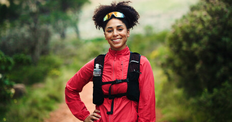 Fitness, portrait and smile of woman in forest for start of cardio training, hiking or marathon. Backpacking, exercising and trail running with happy athlete or runner outdoor in nature for challenge