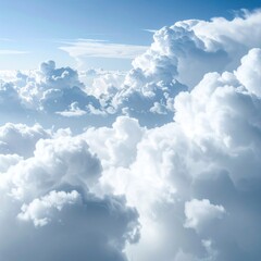 Breathtaking aerial view of fluffy, cumulus clouds under a bright blue sky, creating a serene and ethereal atmosphere
