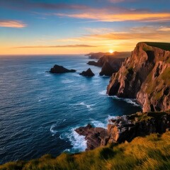 Coastal cliffs meet the sea at sunset