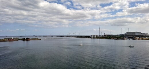 Copenhagen's Green Horizon: Modern Skyline and Offshore Wind Farm at Sunset