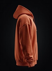 Side profile of a burnt orange hoodie