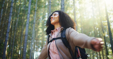 Freedom, outdoor and woman in forest with stretch, peaceful mood and nature in hiking adventure. Achievement, happy and hiker in woods with open arms, fresh air and travel on trekking journey.
