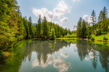 Obraz premium Blajzloch lake in slovak paradise national park in Slovakia. Beautiful and peaceful lake with crystal clear water