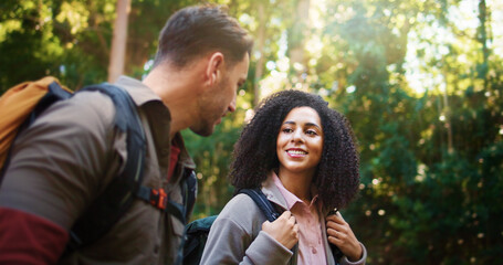 Hiking, walking and smile with couple in nature for holiday, trekking adventure and bonding. Backpacking date, environment and vacation with man and woman in forest for love, support and hobby