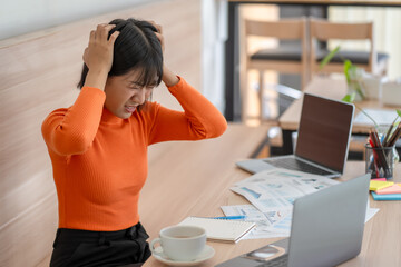 Woking woman with stressed and worried about working mistake and problems
