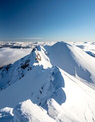 Snowy mountain peaks, clear sky
