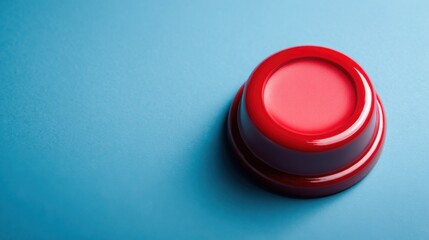 Bold red button on blue background representing emotional logic and behavior pattern trigger concepts