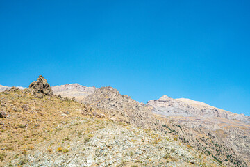 The scenic view of Reşko summit in the Sat (Cilo) mountains, Serpel and Horgedim plateau with its glaciers and glacier rivers in Hakkari, Turkey.