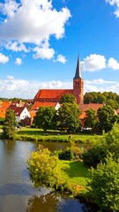 Fototapeta premium Picturesque village church by a pond