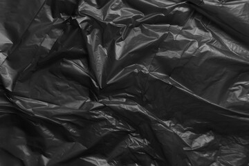 Black plastic bag texture background. Reuse and Recycle concept.