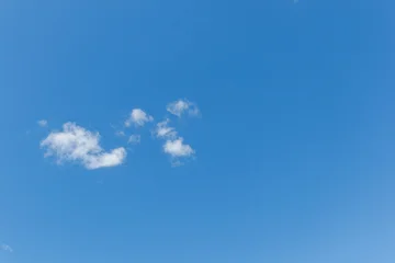 Minimal blue sky with small white clouds © Chmutphoto