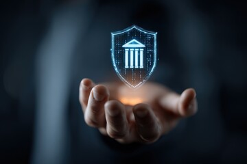 A hand cradles a glowing, digital shield depicting a building, symbolizing protection