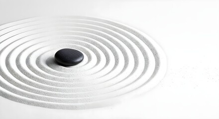 Obraz premium A single dark stone rests in the center of meticulously raked white sand patterns.