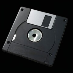 Obraz premium CloseUp Shot of Black Floppy Disk with Silver Metal Plate in 3D Effect on Black Background