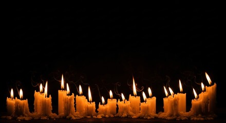 Row of Melted Candles Burning Brightly in the Dark Dramatic Lighting Atmospheric Spooky Moody