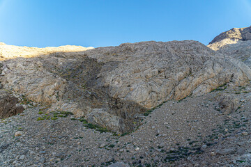 The scenic view of Reşko summit in the Sat (Cilo) mountains, Serpel and Horgedim plateau with its glaciers and glacier rivers in Hakkari, Turkey.