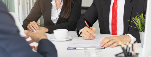 Client signing in mortgage contract agreement.