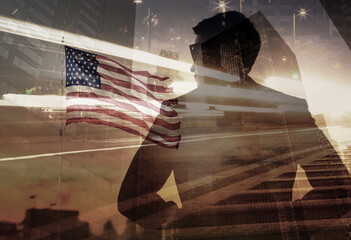 Successful confident man looking for opportunity, American flag with a business silhouette and...