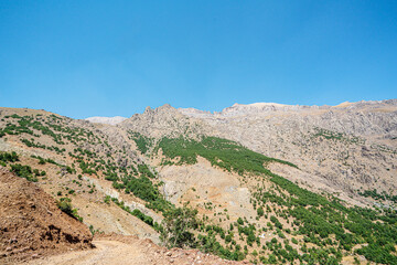 The scenic view of Reşko summit in the Sat (Cilo) mountains, Serpel and Horgedim plateau with its glaciers and glacier rivers in Hakkari, Turkey.