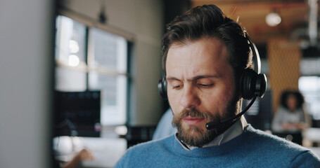 Headset, serious and man call center consultant in office with crm, communication or contact. Professional, mic and male technical support agent for customer service consultation in workplace.