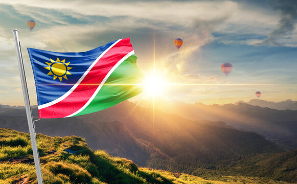 Namibia flag waving in beautiful scenery. Namibia national flag for independence day.