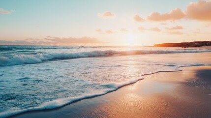 Golden sunset over a tranquil beach. Foamy waves lap at the shore