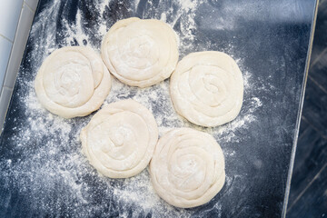 A close up of a doughnut with a lot of flour on it