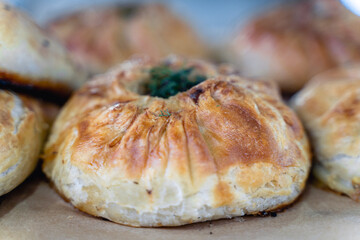 A pastry with a green topping sits on a table