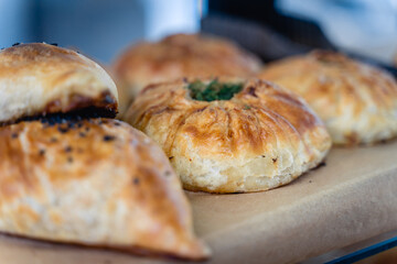 A close up of a pastry with a green herb on top