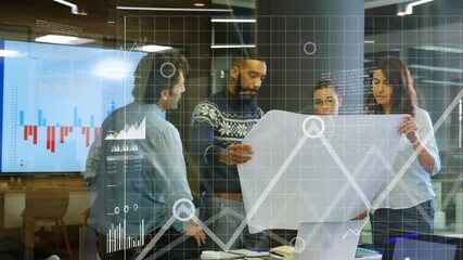 Mid adult man unfolding blueprint, activating floating business charts and guiding team review - Powered by Adobe