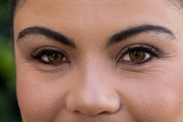 Close-up of woman's eyes with natural makeup, showcasing beauty and elegance