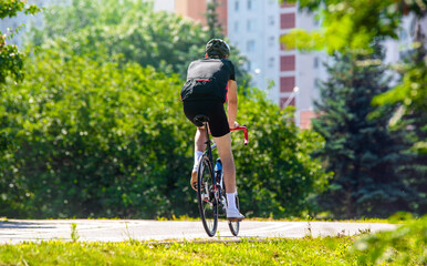 Fototapeta premium Cyclist ride on the bike path in the city Park 
