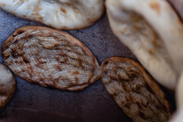 Uzbek flatbread whist on hay of tandoor and get ready. Cakes are ruddy and juicy, with appetizing...