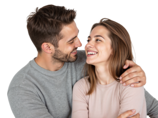 Smiling couple sharing a joyful moment together in a cozy indoor setting during daylight hours