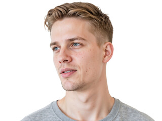 Obraz premium A young man with light brown hair and blue eyes stands against a plain white wall, portraying a thoughtful expression. He wears a simple gray shirt and appears relaxed.