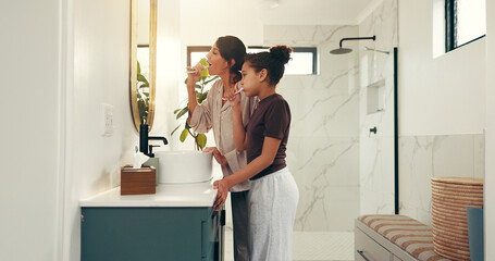 Child, mother and brushing teeth with mirror in bathroom for fresh breath, oral hygiene and...