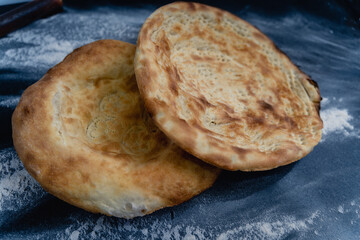 Two round breads with a crust on top