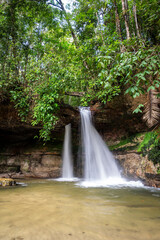 Obraz premium Beautiful view to water coming out of holes in Pedra Furada waterfall