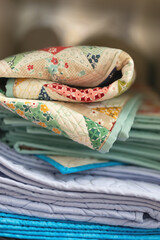 Vertical stack of folded quilts