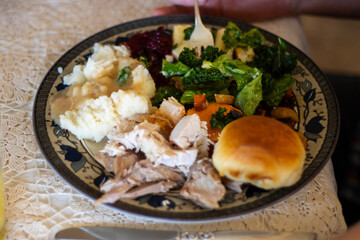 Thanksgiving Plate with Turkey, Greens, and Roll