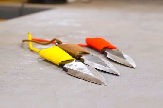New homemade throwing knives with, colorful cords
