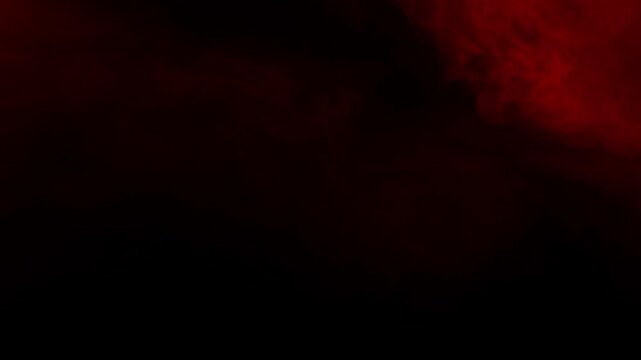 Ominous red fog or smoke drifts slowly across a dark background, perfect atmospheric texture for creating suspense in horror or thriller projects