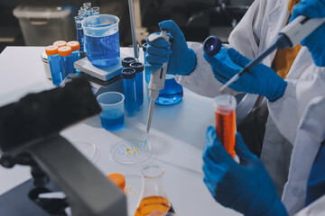 Fototapeta premium Collaboration, tablet or science with people in lab together for research or development. Innovation, tech and microscope with scientist team in clinical trial for planning or medical investigation