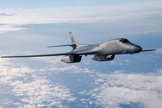 A B1 bomber is soaring majestically through the clouds, showcasing its impressive and advanced design and capabilities
