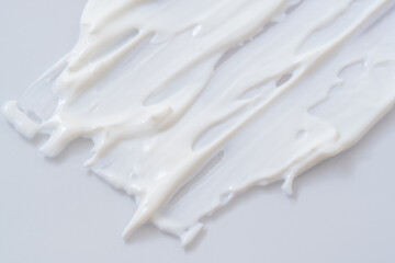 白いクリームを塗り広げたテクスチャー