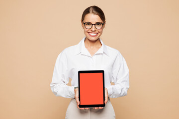 Young successful employee IT business woman corporate lawyer wear classic white shirt glasses work in office hold use blank screen digital tablet pc computer isolated on plain beige background studio.