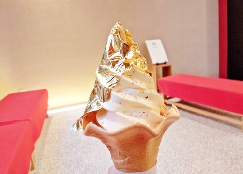 A luxurious ice cream topped with edible gold leaf, enjoyed at Higashi Chaya District in Kanazawa, Japan.
