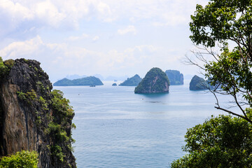 View through the jungle to the Andaman sea and tropical rock islands in Krabi province of Thailand