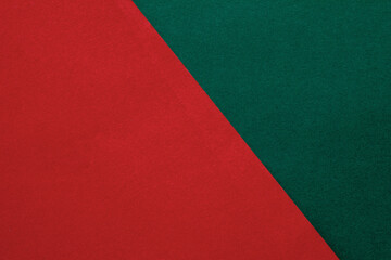 red and green paper background,Red and green cardstock arranged diagonally,red and dark green christmas background