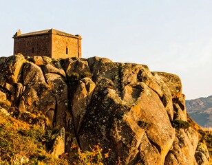 Small stone structure atop rocky outcrop